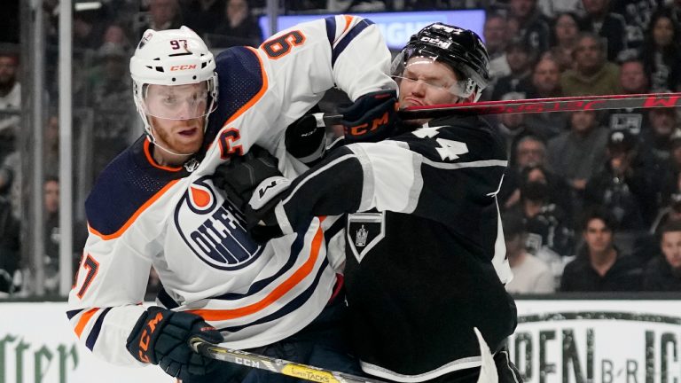 Edmonton Oilers centre Connor McDavid, left, and Los Angeles Kings defenseman Mikey Anderson battle during the first period in Game 6 of an NHL hockey Stanley Cup first-round playoff series Thursday, May 12, 2022, in Los Angeles. (Mark J. Terrill/AP)