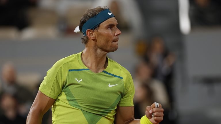 Spain's Rafael Nadal celebrates winning a point as he plays Serbia's Novak Djokovic during their quarterfinal match of the French Open tennis tournament. (Jean-Francois Badias/AP)