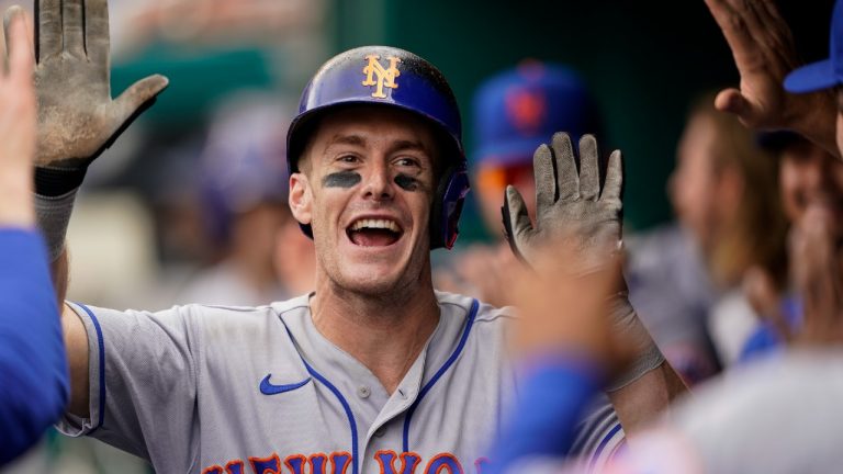 New York Mets' Mark Canha celebrates his solo home run with his teammates during the ninth inning of a baseball game against the Washington Nationals at Nationals Park, Thursday, May 12, 2022, in Washington. (Alex Brandon/AP)