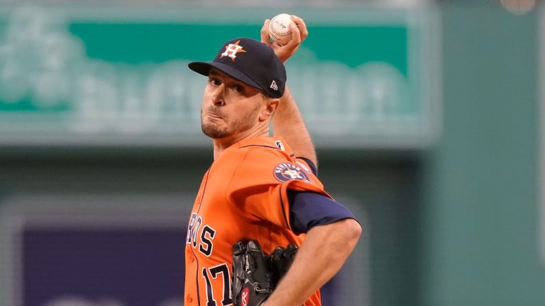 Houston Astros' Jake Odorizzi (17) is tended to on the mound after the fifth inning of a baseball game against the Boston Red Sox, Monday, May 16, 2022, in Boston. (Steven Senne/AP Photo)