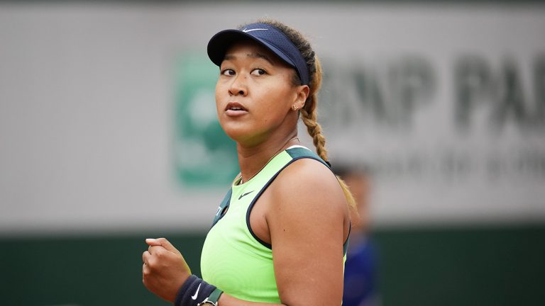 Japan's Naomi Osaka clenches her fist after scoring a point. (Christophe Ena/AP)