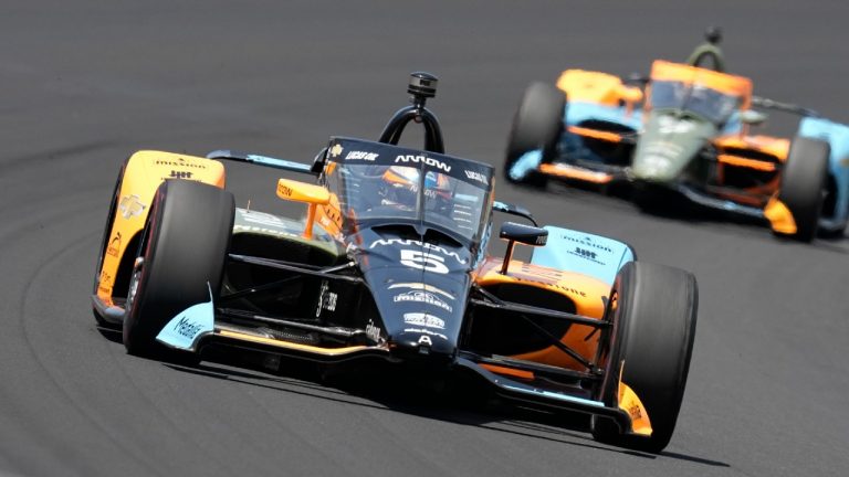 Pato O'Ward, of Mexico, drives into the first turn during the Indianapolis 500 auto race at Indianapolis Motor Speedway, Sunday, May 29, 2022, in Indianapolis. (Darron Cummings/AP)