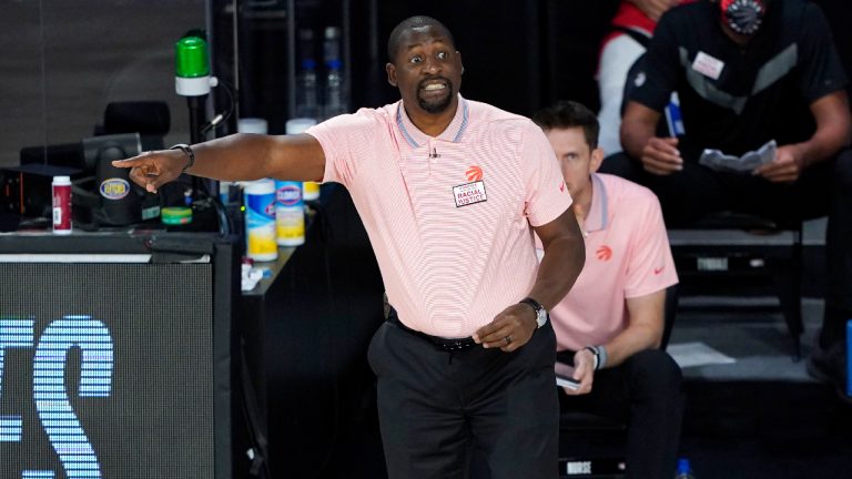 Toronto Raptors assistant coach Adrian Griffin reacts during the second half of an NBA basketball game. (Ashley Landis/AP)