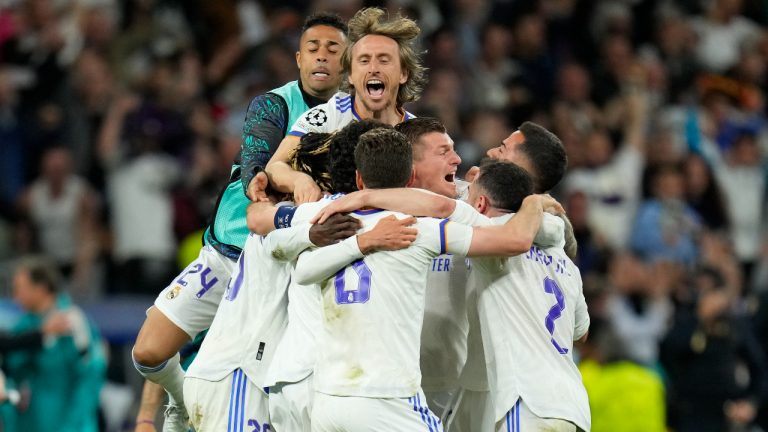 Real Madrid players celebrate at the end of the Champions League semi final, second leg soccer match between Real Madrid and Manchester City at the Santiago Bernabeu stadium in Madrid, Spain, Wednesday, May 4, 2022. (Manu Fernandez/AP)