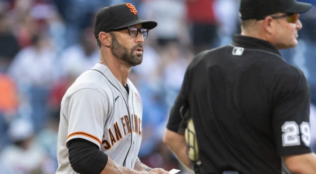 Giants manager Gabe Kapler stands on the field for national anthem on  Memorial Day