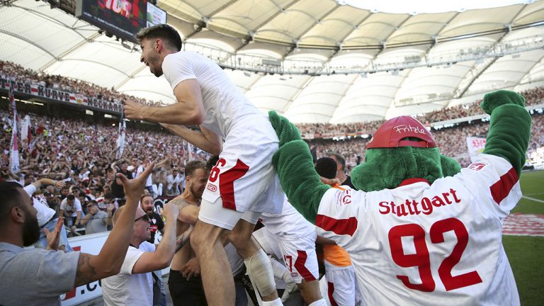 Stuttgart's Atakan Karazor celebrates with supporters after the German Bundesliga soccer match between VfB Stuttgart and 1. FC Cologne in Stuttgart, Germany, Saturday, May 14, 2022. (Tom Weller/dpa via AP)