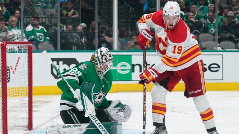 Dallas Stars goaltender Jake Oettinger (29) blocks a shot by Calgary Flames left wing Matthew Tkachuk (19) in the second period of Game 4 of an NHL hockey Stanley Cup first-round playoff series, Monday, May 9, 2022, in Dallas. (Tony Gutierrez/AP)