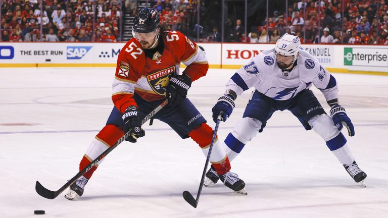 Florida Panthers defenceman MacKenzie Weegar (52) keeps the puck away from Tampa Bay Lightning left wing Alex Killorn (17) during the second period of Game 1 of an NHL hockey second-round playoff series. (Reinhold Matay/AP)