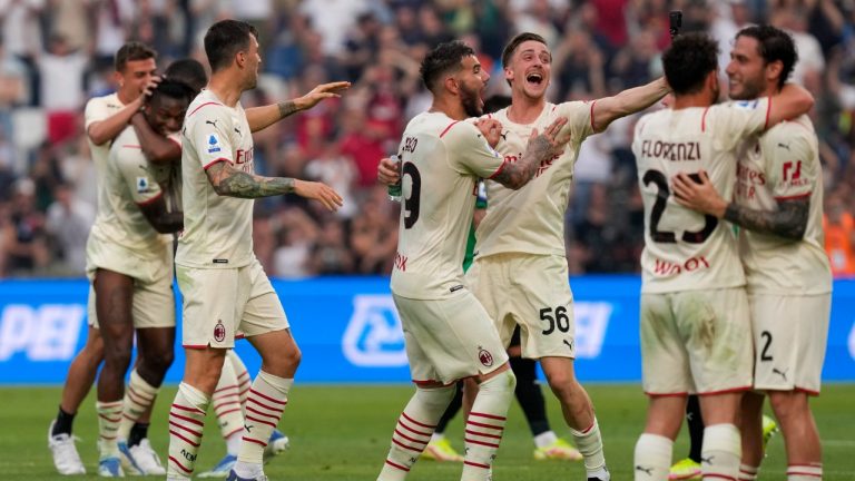 AC Milan players celebrate after winning the Italian Serie A title at the end of a match against Sassuolo, at the Citta del Tricolore stadium, in Reggio Emilia, Italy, Sunday, May 22, 2022. (Antonio Calanni/AP)