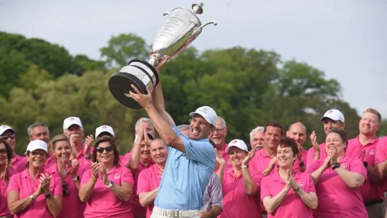 Steven Alker raises the Alfred S. Bourne Trophy, Sunday, May 29, 2022, after winning the Senior PGA Championship golf tournament at Harbor Shores in Benton Harbor, Mich. (Don Campbell/AP)