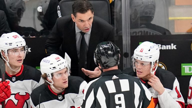 New Jersey Devils coach Alain Nasreddine argues with official Dan O'Rourke (9) during the first period of the team's NHL hockey game against the Boston Bruins, Tuesday, Jan. 4, 2022, in Boston. (Charles Krupa/AP)