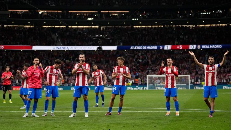 Atletico Madrid players celebrate at the end of the Spanish La Liga soccer match between Atletico Madrid and Real Madrid at the Wanda Metropolitano stadium in Madrid, Spain, Sunday, May 8, 2022. (Manu Fernandez/AP)