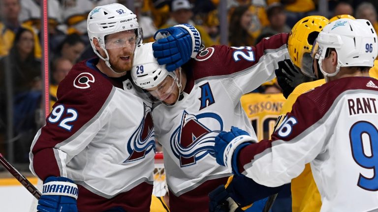 Avalanche centre Nathan MacKinnon (29) celebrates with teammates Gabriel Landeskog (92) after McKinnon scored a goal against the Predators during the first period in Game 3 of their Stanley Cup first-round playoff series Saturday in Nashville, Tenn. (Mark Zaleski/AP)