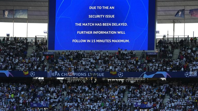 The display announces delay of the Champions League final soccer match between Liverpool and Real Madrid at the Stade de France in Saint Denis near Paris, Saturday, May 28, 2022. (Petr David Josek/AP)