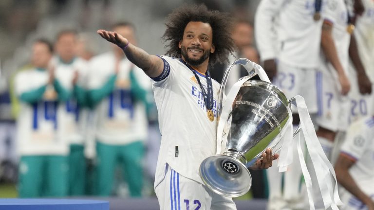 Real Madrid's Marcelo gestures as he holds the trophy after winning the Champions League final soccer match between Liverpool and Real Madrid at the Stade de France in Saint Denis near Paris, Saturday, May 28, 2022. (Kirsty Wigglesworth/AP)