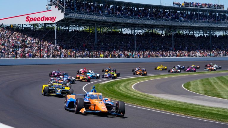 Scott Dixon of New Zealand leads the field through the first turn on the start of the Indianapolis 500 auto race at Indianapolis Motor Speedway in Indianapolis, Sunday, May 30, 2021. (Darron Cummings/AP)