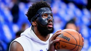 Wearing a mask to protect the orbital fracture he suffered against the Raptors, Joel Embiid was scheduled to play in Game 3 of the Sixers' series against Miami on Friday night. (Matt Slocum/AP)