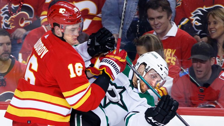 Calgary Flames defenceman Nikita Zadorov (16) checks Dallas Stars centre Radek Faksa (12) during second period NHL first-round playoff series action.  (Larry MacDougal/CP)