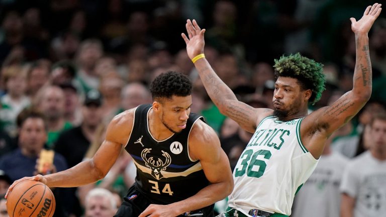 Milwaukee Bucks forward Giannis Antetokounmpo (34) tries to drive past Boston Celtics guard Marcus Smart (36) during the second half of Game 7 of an NBA basketball Eastern Conference semifinals playoff series. (Steven Senne/AP)