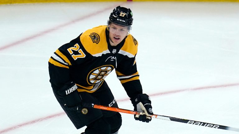 Boston Bruins defenseman Hampus Lindholm looks for a pass during the first period of an NHL game against the Tampa Bay Lightning, Thursday, March 24, 2022, in Boston. (AP)