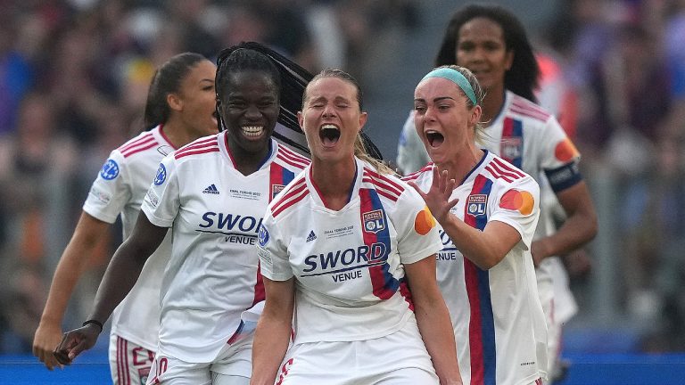 Olympique Lyon's Amandine Henry, center, celebrates after scoring her side's opening goal during the Women's Champions League final soccer match between Barcelona and Olympique Lyonnais at Allianz Stadium in Turin, Italy, Saturday, May 21, 2022. (Spada/LaPresse via AP)