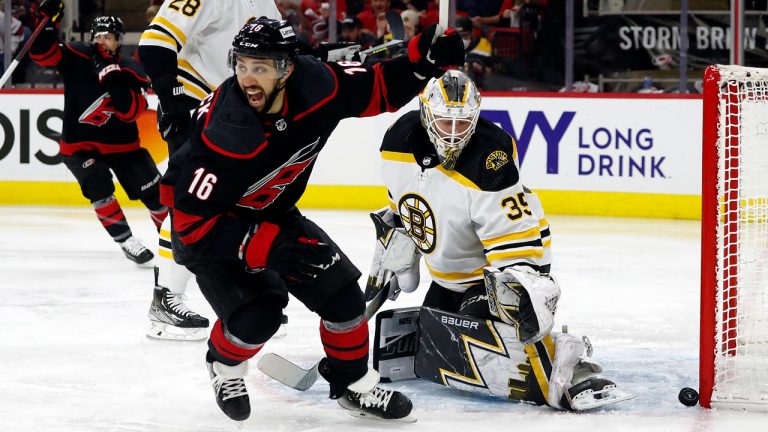 Carolina Hurricanes' Vincent Trocheck (16) celebrates a goal by Sebastian Aho, not seen, on Boston Bruins goaltender Linus Ullmark (35) during the second period of Game 2 of an NHL hockey Stanley Cup first-round playoff series. (Karl B DeBlaker/AP)