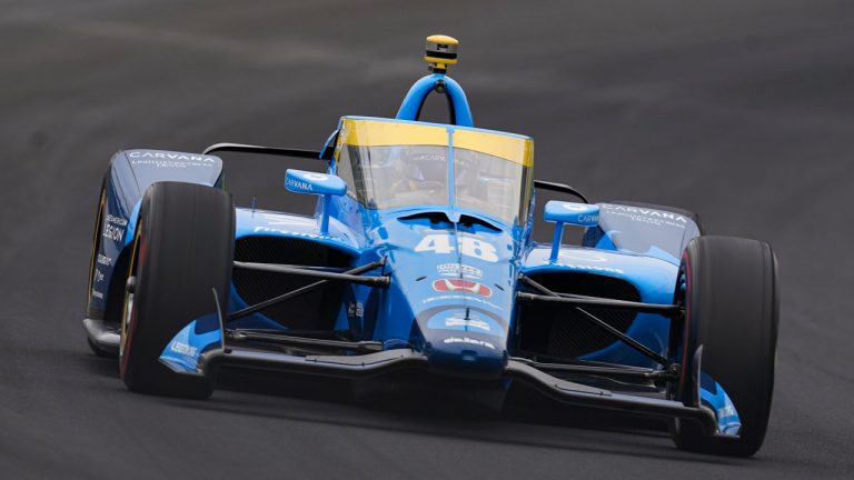 Jimmie Johnson drives through the first turn during qualifications for the Indianapolis 500 auto race at Indianapolis Motor Speedway. (Michael Conroy/AP)