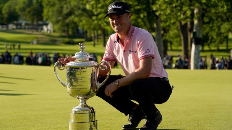 Justin Thomas poses with the Wanamaker Trophy after winning the PGA Championship golf tournament in a playoff against Will Zalatoris at Southern Hills Country Club, Sunday, May 22, 2022, in Tulsa, Okla. (Eric Gay/AP)