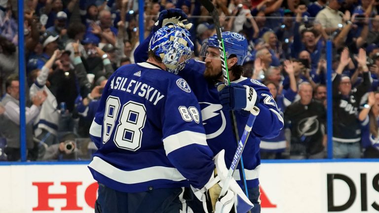 Tampa Bay Lightning goaltender Andrei Vasilevskiy (88) celebrates with defenseman Ryan McDonagh (27) after the Lightning eliminated the Florida Panthers during Game 4 of an NHL hockey second-round playoff series. (Chris O'Meara/AP)