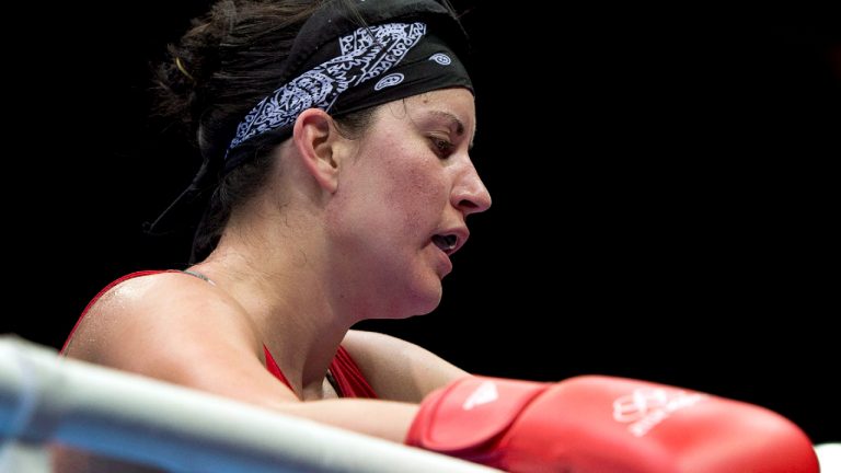 Canada's Mary Spencer returns to her corner after losing 17-14 against China's Jinzi Li during their 68-75kg women's quarterfinal bout at the 2012 Summer Olympics Monday, August 6, 2012 in London.(Ryan Remiorz/CP)