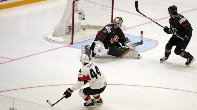 Pius Suter from Switzerland scores his team's fifth goal during the Group A Hockey World Championship game between Canada and Switzerland in Helsinki, Finland, Saturday, May 21 2022. (CP/AP)