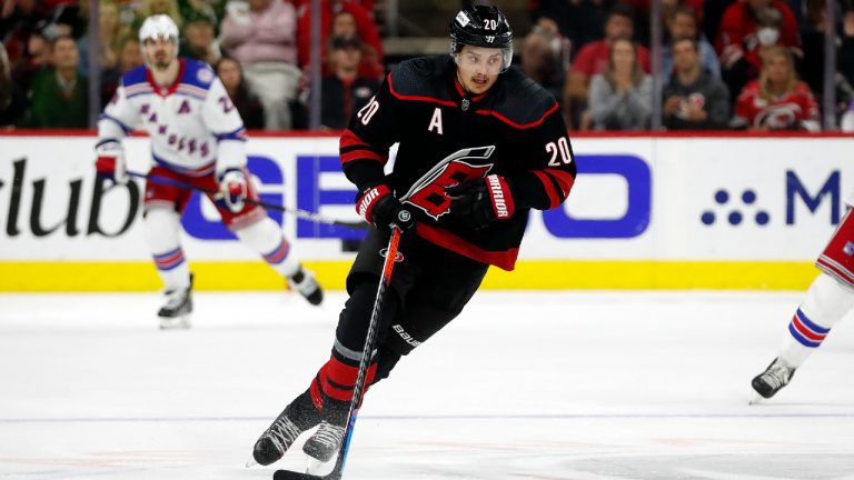 Carolina Hurricanes' Sebastian Aho (20) moves the puck up-ice against the New York Rangers during the second period of Game 2 of an NHL hockey Stanley Cup second-round playoff series in Raleigh, N.C., Friday, May 20, 2022. (Karl B DeBlaker/AP)