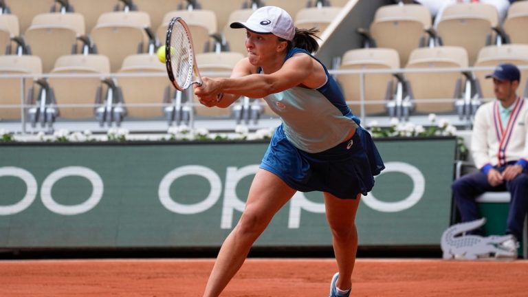 Poland's Iga Swiatek plays a shot against Montenegro's Danka Kovinic during their third round match at the French Open tennis tournament in Roland Garros stadium in Paris, France, Saturday, May 28, 2022. (Michel Euler/AP)