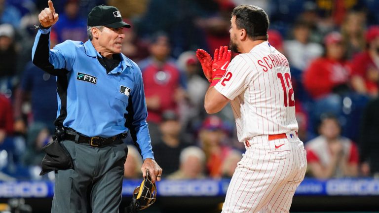 Philadelphia Phillies' Kyle Schwarber, right, reacts to umpire Ángel Hernández after striking out during the ninth inning of a baseball game against the Milwaukee Brewers, Sunday, April 24, 2022, in Philadelphia. (Matt Slocum/AP)