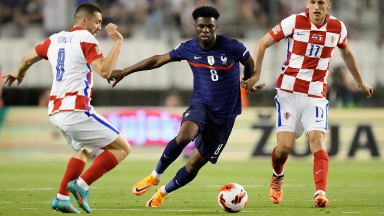 France's Aurelien Tchouameni, center, duels for the ball with Croatia's Mateo Kovacic, left, and Croatia's Ante Budimir during the UEFA Nations League soccer match between Croatia and France at the Poljud stadium, in Split, Croatia, Monday, June 6, 2022. (Darko Bandic/AP)