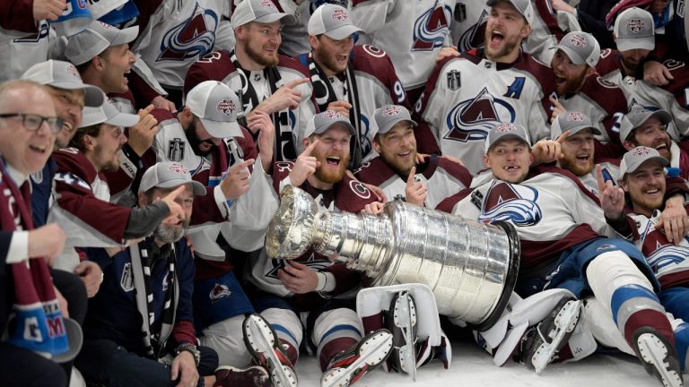 The Colorado Avalanche pose with the Stanley Cup after defeating the Tampa Bay Lightning 2-1 in Game 6 of the NHL hockey Stanley Cup Finals on Sunday, June 26, 2022, in Tampa, Fla. (Phelan Ebenhack/AP Photo)