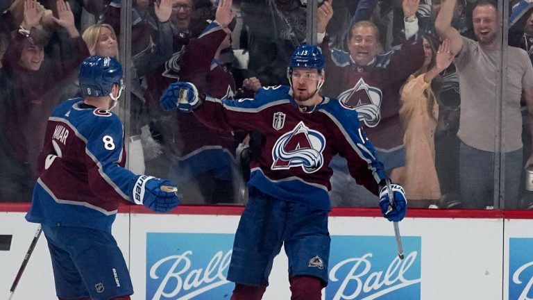 Colorado Avalanche right wing Valeri Nichushkin (13) celebrates his goal against the Tampa Bay Lightning with Cale Makar (8) during the first period of Game 1 of the NHL hockey Stanley Cup Final on Wednesday, June 15, 2022, in Denver. (John Locher/AP)