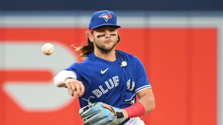 Toronto Blue Jays shortstop Bo Bichette throws to first base to put out Boston Red Sox second baseman Trevor Story during fourth inning American League baseball action in Toronto on Tuesday June 28, 2022. (Jon Blacker/CP)