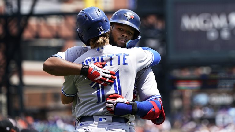 Toronto Blue Jays' Bo Bichette hugs Vladimir Guerrero Jr. after they both scored on Guerrero's two-run home run during the fourth inning of a baseball game against the Detroit Tigers. (Carlos Osorio/AP)