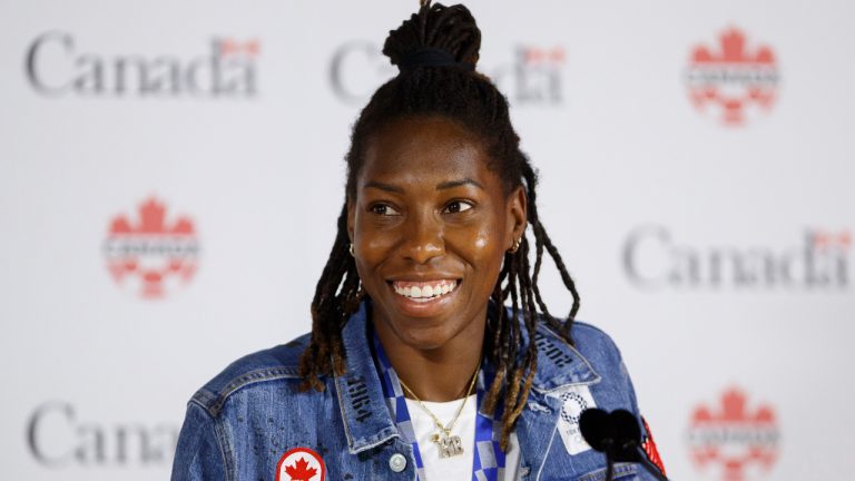 Canadian soccer team's Kadeisha Buchanan smiles at a press conference at BMO Field in Toronto on Aug. 10, 2021. (Cole Burston/CP)