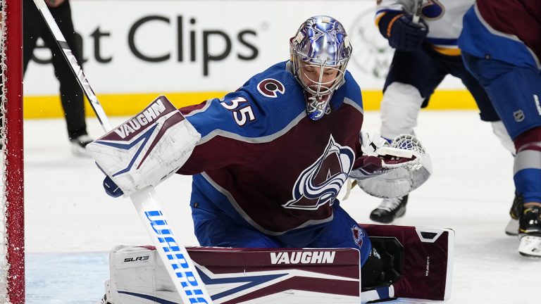 Colorado Avalanche goaltender Darcy Kuemper (35) turns away the puck during the second period in Game 2 of the team's NHL hockey Stanley Cup second-round playoff series against the St. Louis Blues. (Jack Dempsey/AP)