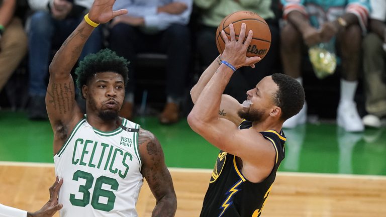 Golden State Warriors guard Stephen Curry (30) puts up a shot against Boston Celtics guard Marcus Smart (36) during the first quarter of Game 4 of basketball's NBA Finals. (Steven Senne/AP)