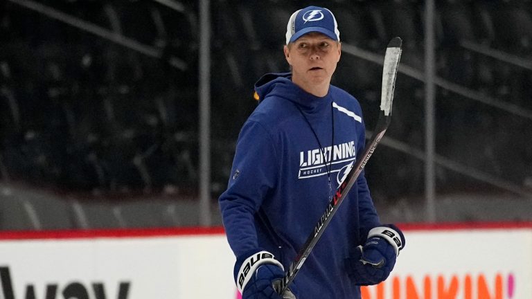 Tampa Bay Lightning head coach Jon Cooper watches during NHL hockey practice, Friday, June 17, 2022, in Denver. (AP Photo/John Locher)