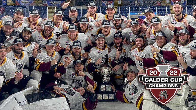 The Chicago Wolves celebrate after winning the 2022 Calder Cup. (Photo via AHL.com)