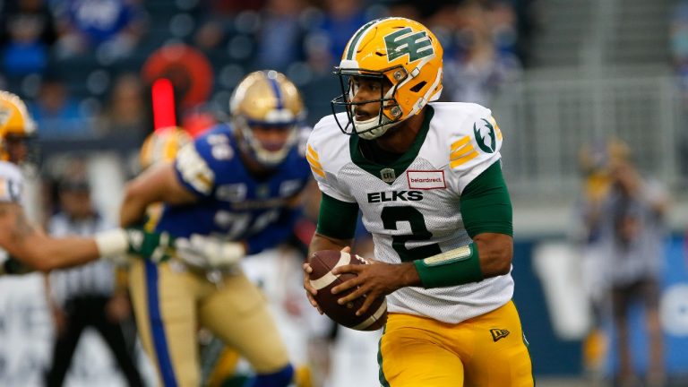 Edmonton Elks quarterback Tre Ford (2) looks downfield against the Winnipeg Blue Bombers during the first half of pre-season CFL action in Winnipeg, Friday, May 27, 2022. (John Woods/THE CANADIAN PRESS)