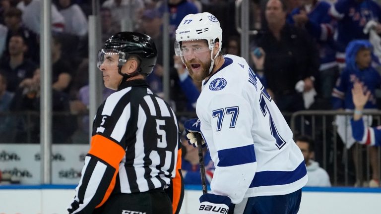 Tampa Bay Lightning defenseman Victor Hedman (77) argues with referee Chris Rooney (5) after being given a two minute penalty for tripping in the third period of Game 2 of the NHL hockey Stanley Cup playoffs Eastern Conference finals, Friday, June 3, 2022, in New York. (John Minchillo/AP Photo)