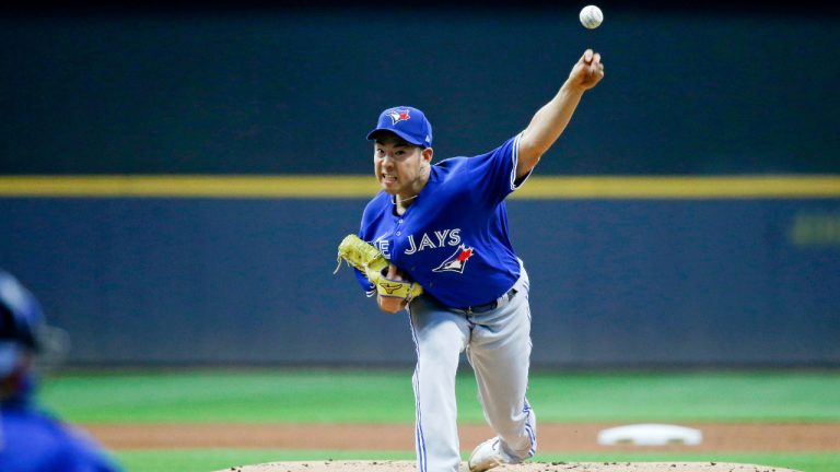 Toronto Blue Jays starting pitcher Yusei Kikuchi delivers against the Milwaukee Brewers during the first inning of a baseball game. (Jon Durr/AP)