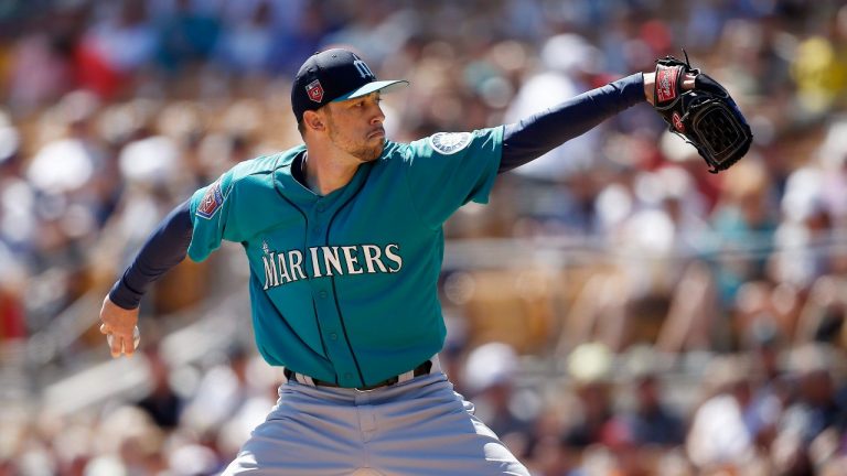 Seattle Mariners relief pitcher Casey Lawrence throws against the Chicago White Sox during the first inning of a spring training baseball game Friday, March 23, 2018, in Glendale, Ariz. (Ross D. Franklin/AP Photo)