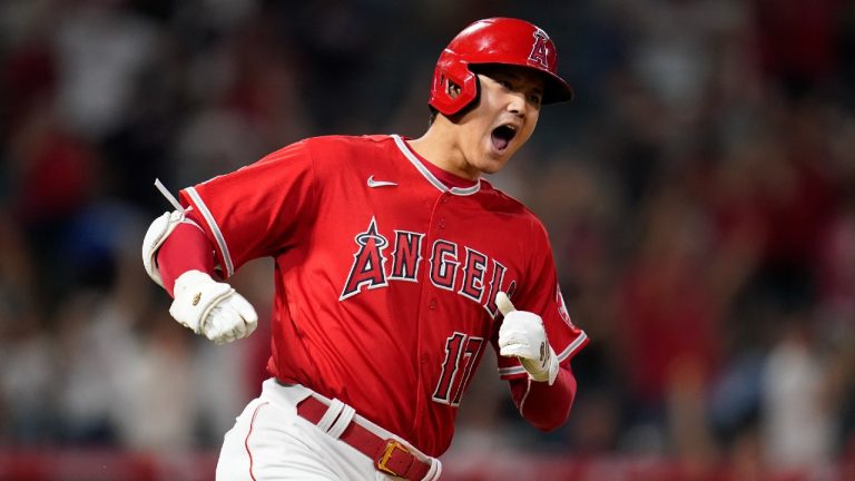 Los Angeles Angels designated hitter Shohei Ohtani (17) reacts after hitting a home run during the ninth inning of a baseball game against the Kansas City Royals in Anaheim, Calif., Tuesday, June 21, 2022. Mike Trout and Tyler Wade also scored. (Ashley Landis/AP)