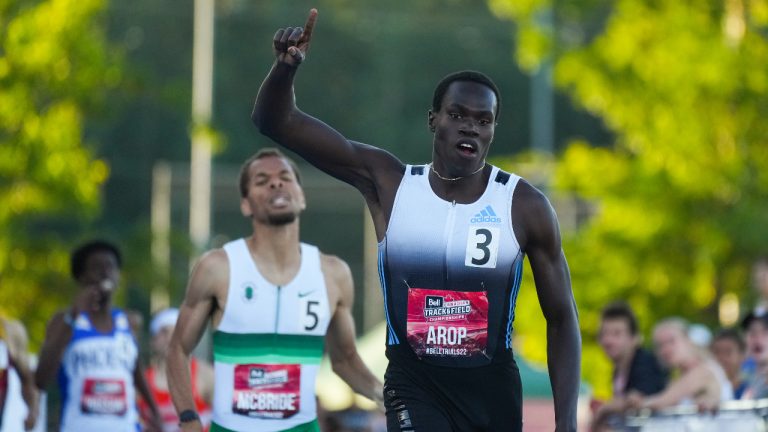 Marco Arop, front right, of Edmonton, Alta., celebrates his first place finish ahead of second place finisher Brandon McBride, of Windsor, Ont., in the men's 800 metre race at the Canadian Track and Field Championships in Langley, B.C. (Darryl Dyck/CP)